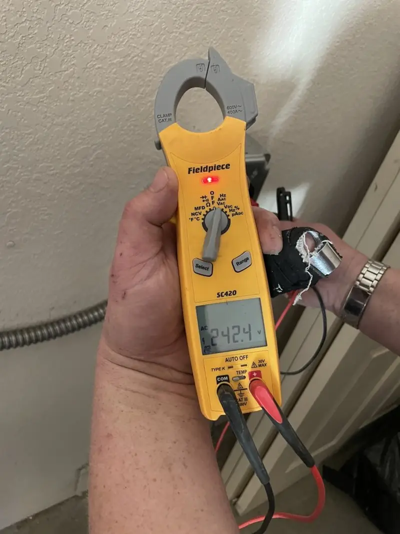 Voltage testing with clamp meter during Electrical Installation Services in Windsor